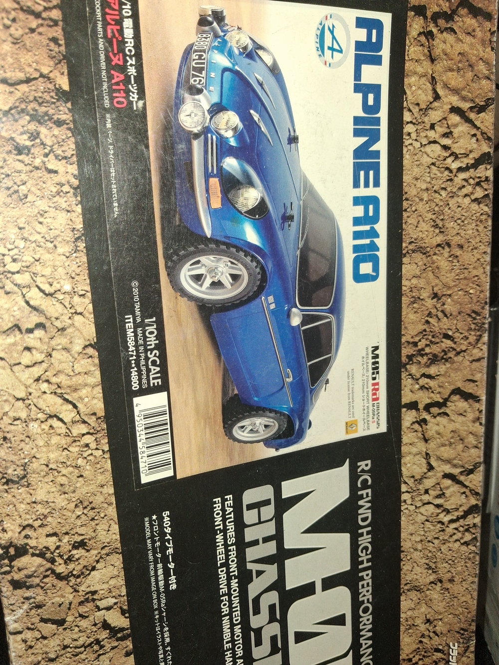 Tamiya 1/10 scale radio-controlled car kit featuring an Alpine A110 body.